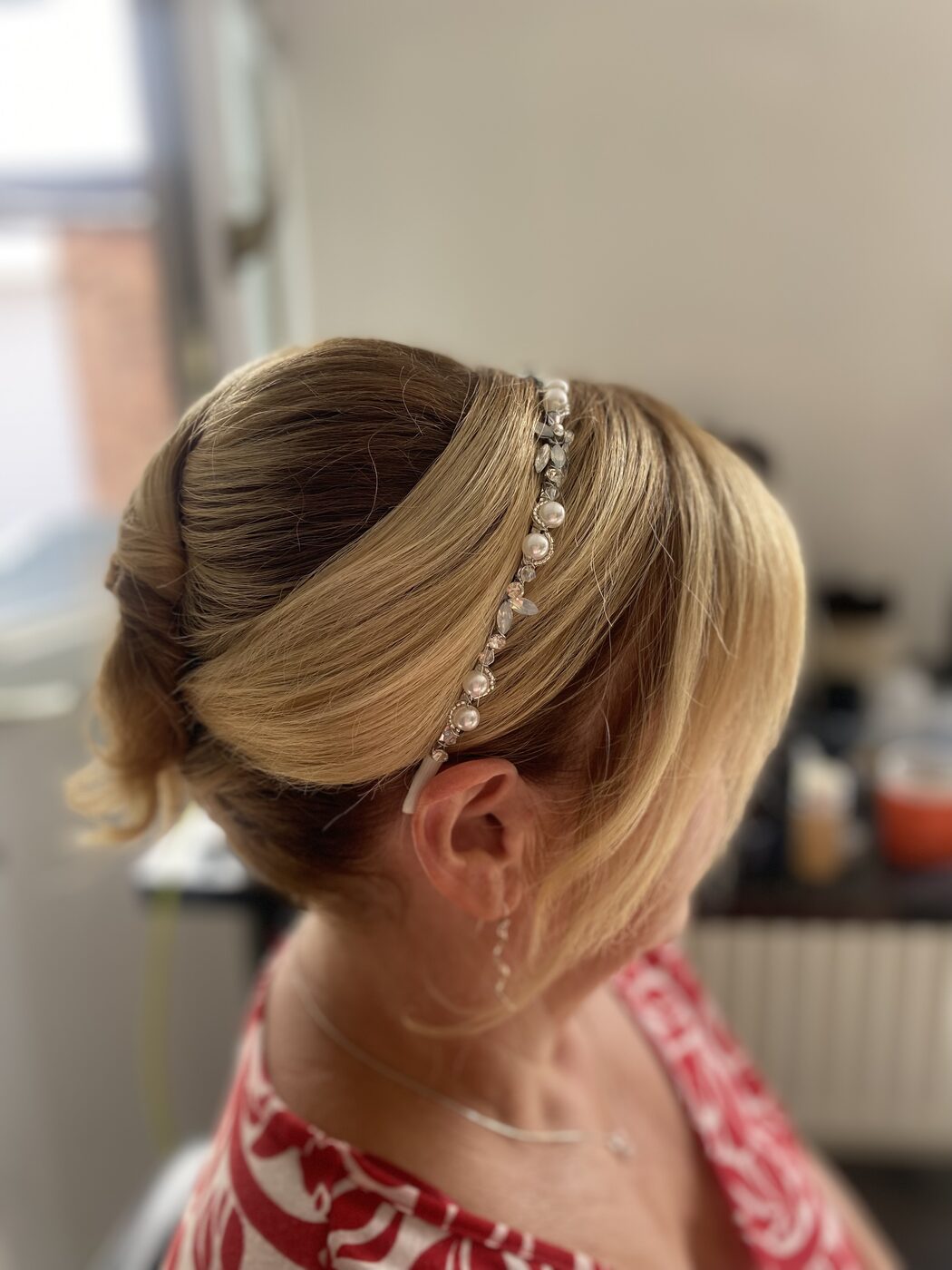 Bridal updo with soft face-framing pieces by Memories by Taylor